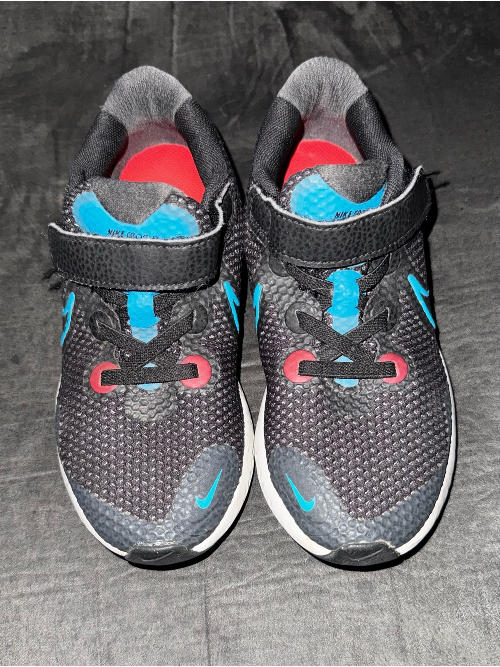 Renew Nike Kids size 13. Running Black Sneakers with Blue and  neon pink .